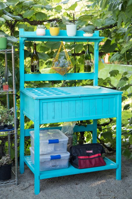 blue garden potting bench with tools planters