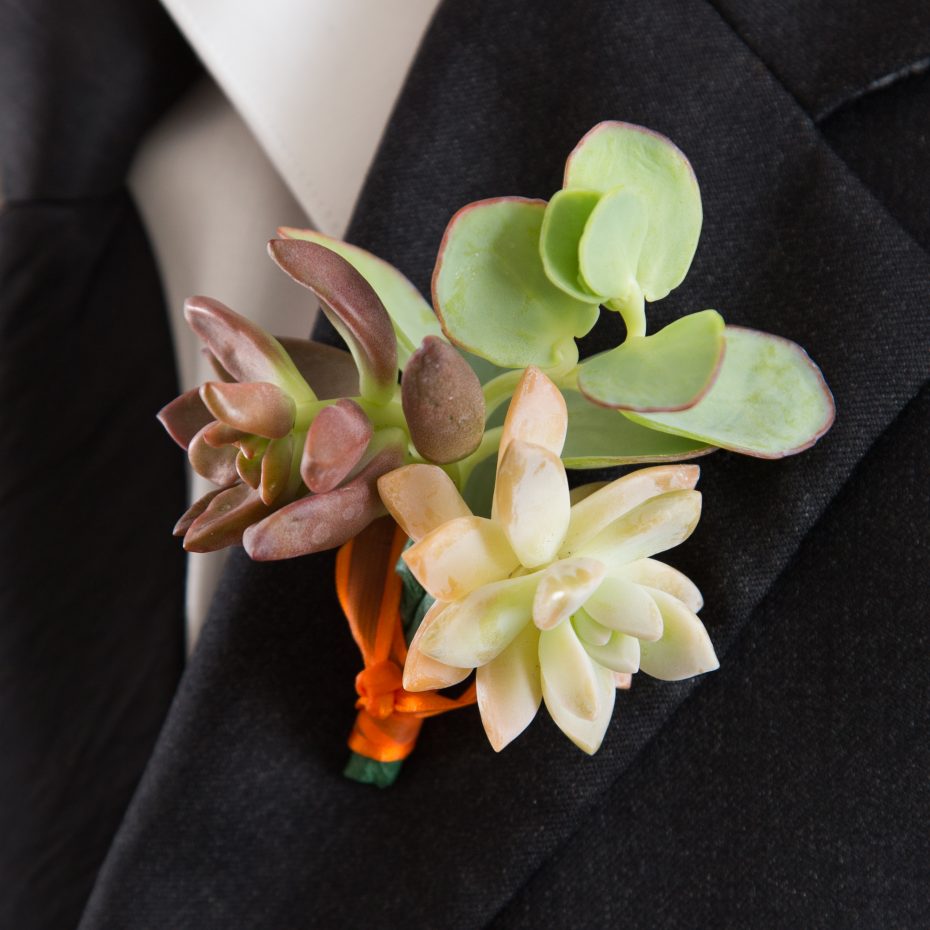 red green pink succulent boutonniere wedding