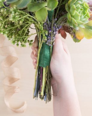 remove ribbon around floral succulent bouquet handle to disassemble for arrangement