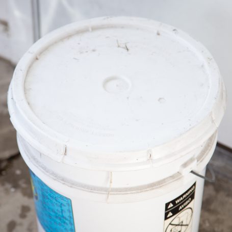 bucket with lid on full of manure tea fertilizer