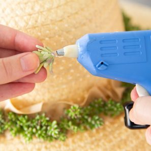 hot glue can be used to attach succulents to hat