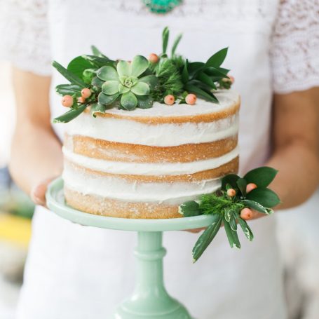 naked wedding cake succulents greenery