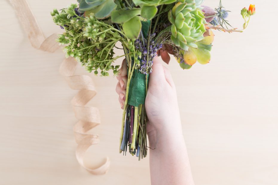 remove ribbon around floral succulent bouquet handle to disassemble for arrangement