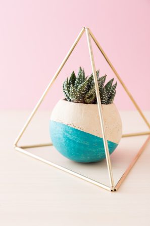 himmeli pyramid around succulent in painted bell cup