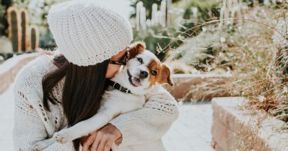 Lucia Romero shutterstock women with dog outside