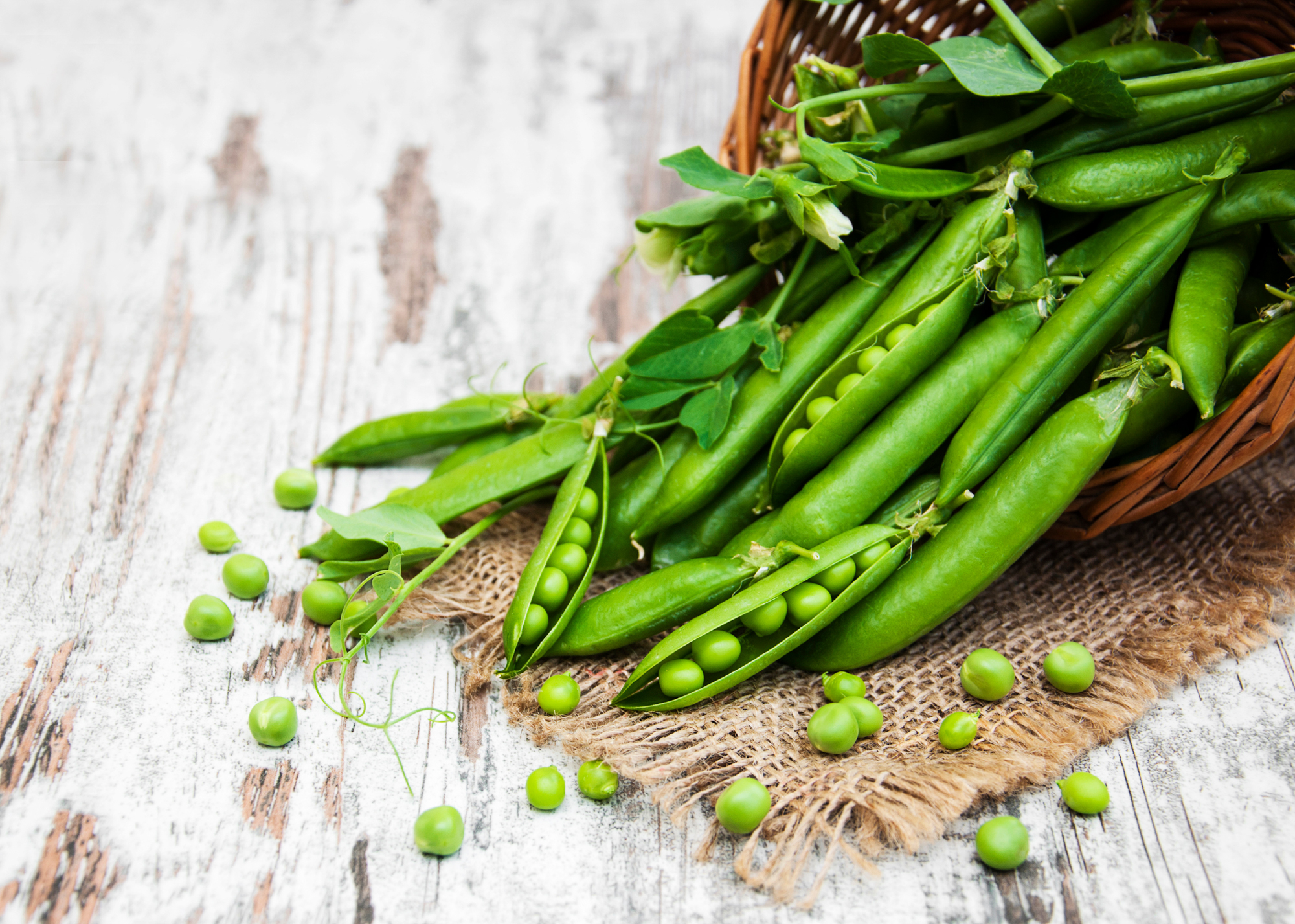 Adobe Stock Es75 close up of peas spilling out of basket