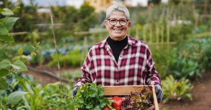 Adobe Stock Sabrina woman holding fresh vegetables in garden