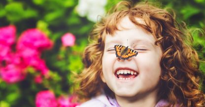 Adobe Stock Ulkas girl with butterfly on nose laughing