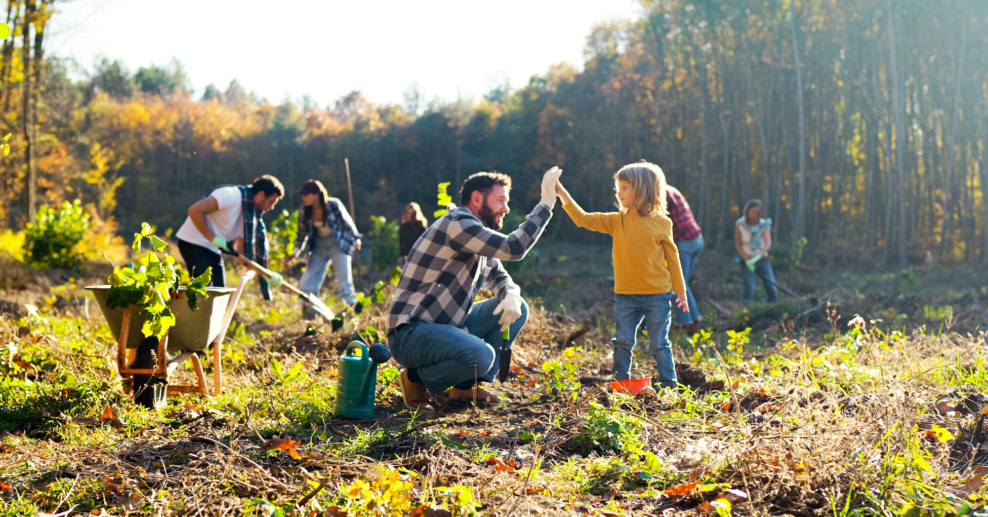 Adobe Stock Ihorvsn man dad daughter girl planting garden hall harvest