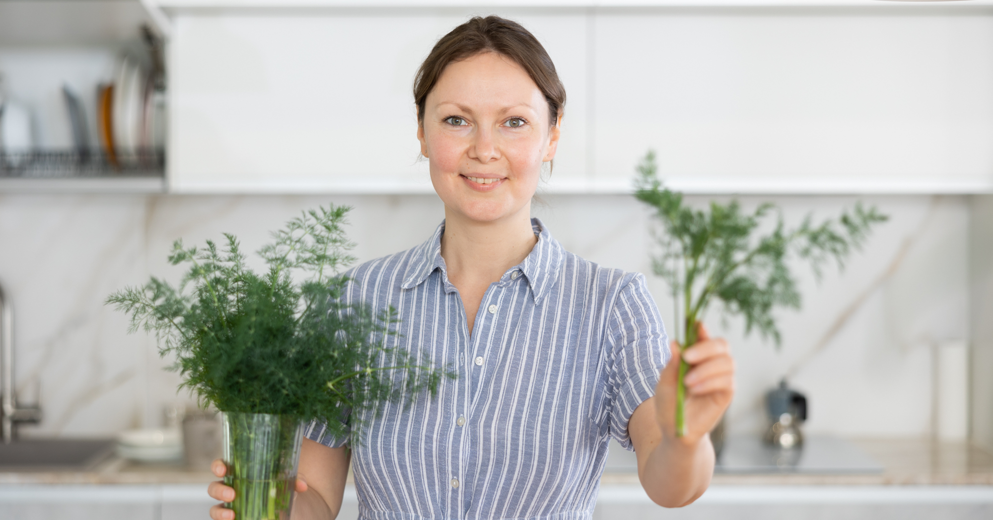 Adobe Stock JackF woman with dill in hands herbs kitchen