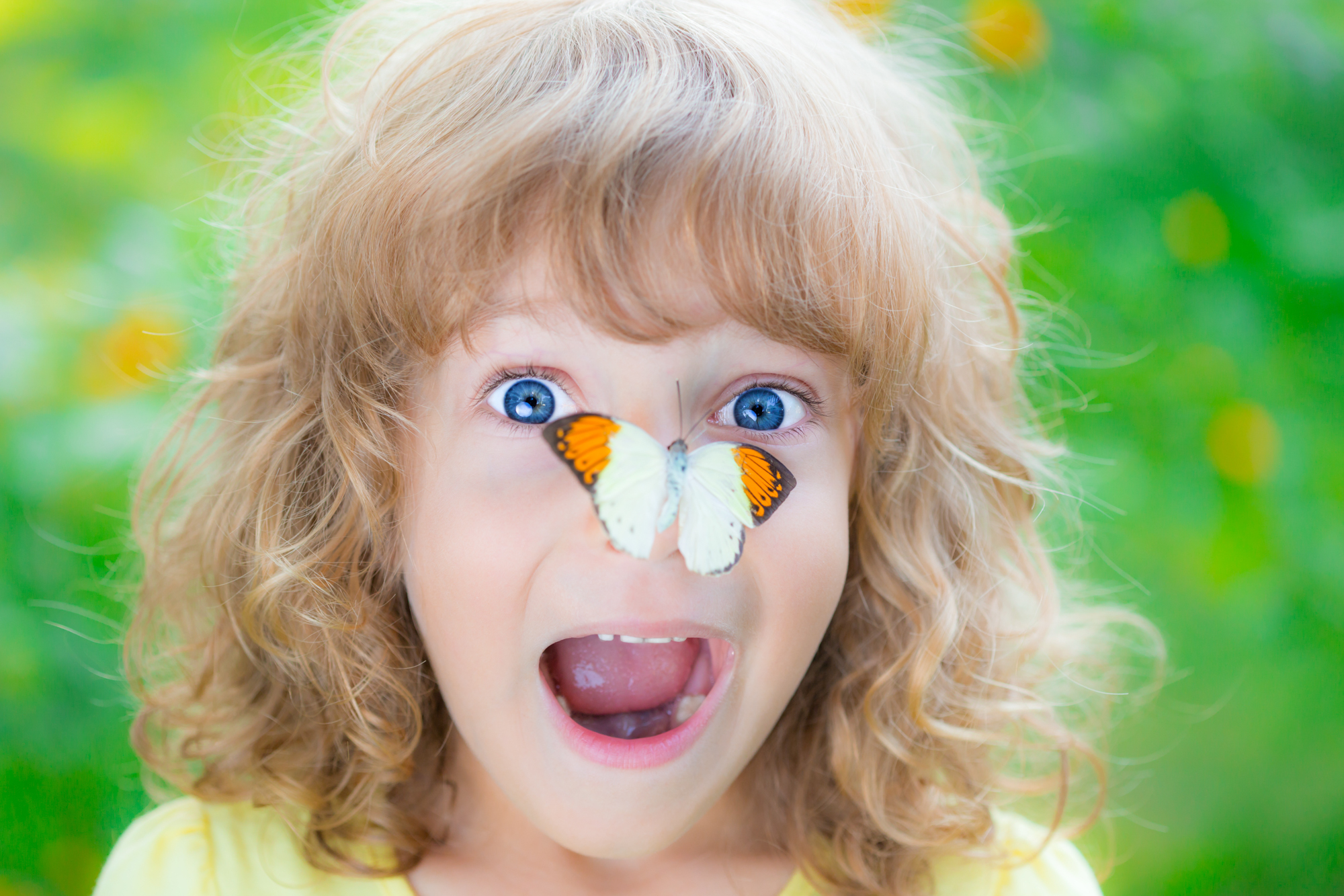 Adobe Stock Sunny Studio girl blue eyes butterfly on nose insect